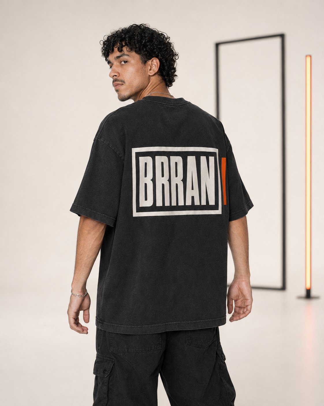FRAME 01 washed-black oversized T-shirt, back view, large framed BRRANI wordmark